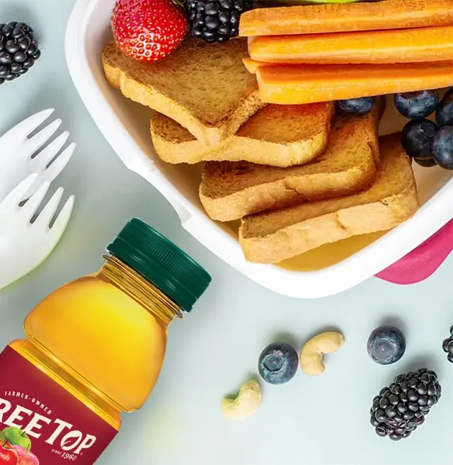 A breakfast spread featuring Tree Top apple juice