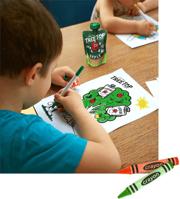 A child coloring a Tree Top themed coloring page