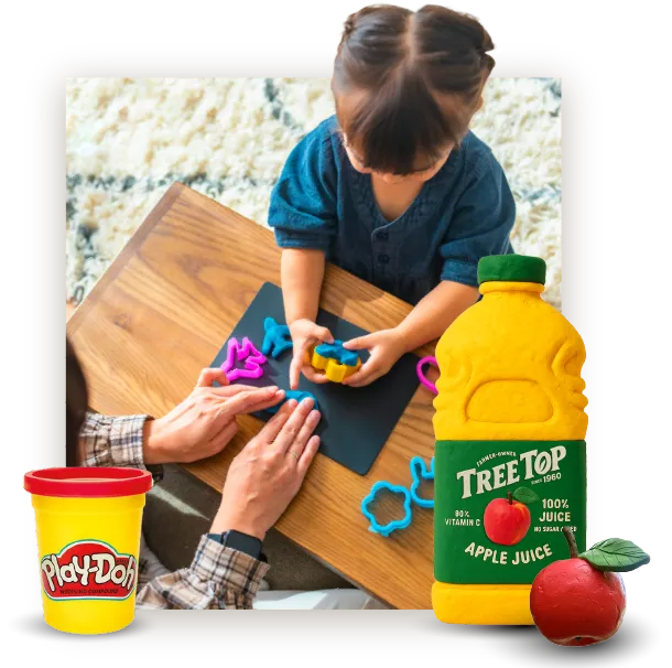 A child and parent playing with Play-Doh