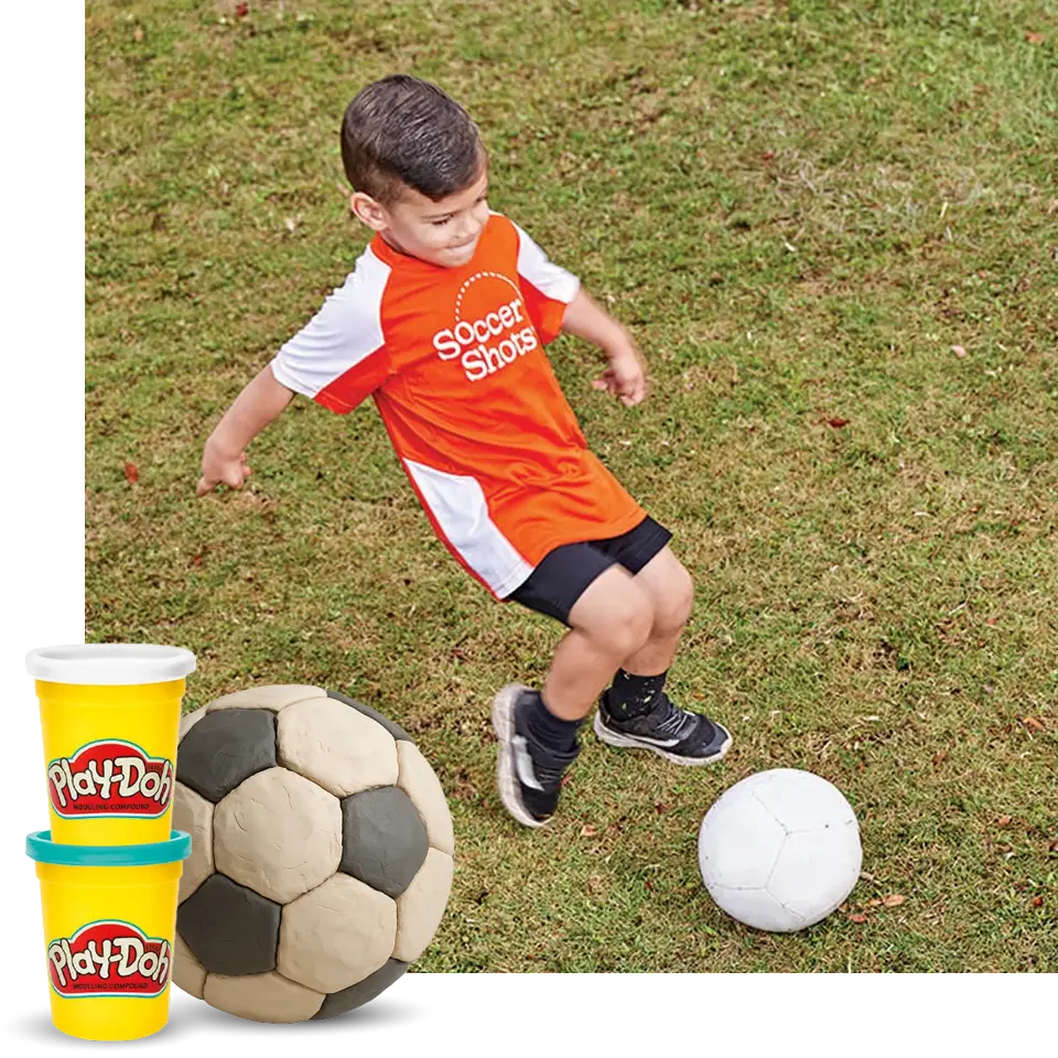 A child kicking a soccer ball